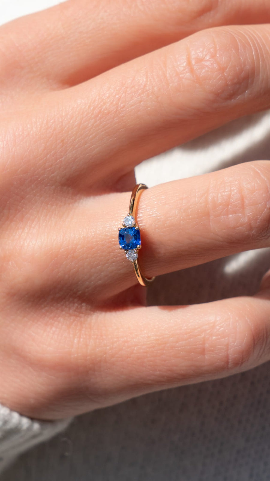 Trilogy ring with blue sapphires